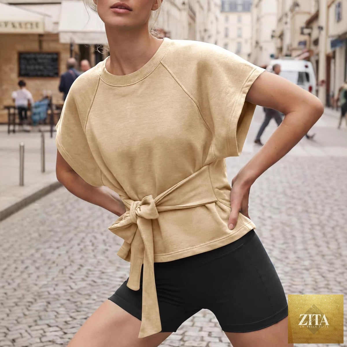 Women's loose round-neck lace-up bow-knot short-sleeve top by Zita La Belle Elite, casualwear with a relaxed fit and stylish details.