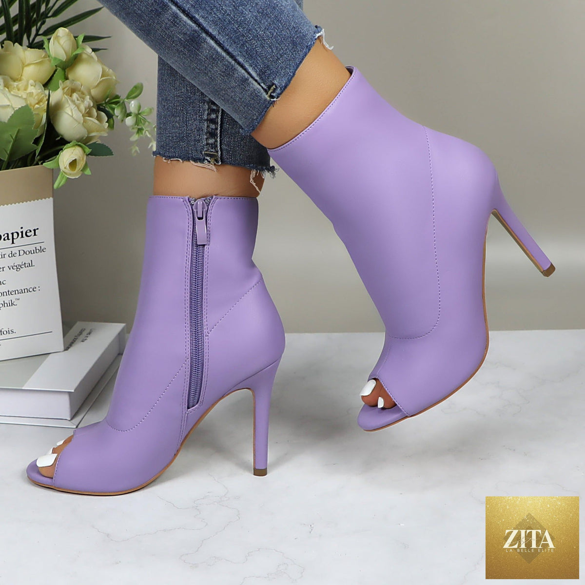 Shiny metallic stiletto boots for women with a sleek dance party style, featuring a high heel and reflective finish.