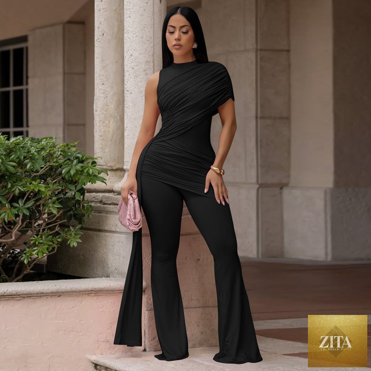Women's Zita La Belle Elite pleated ribbon flare jumpsuit with crew neck, casual fit, and stylish design, shown in a relaxed pose.