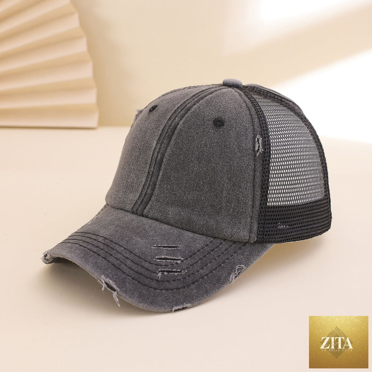 Distressed washed mesh baseball cap by Zita La Belle Elite, unisex frayed hat for outdoor and daily wear showing a casual, worn look.
