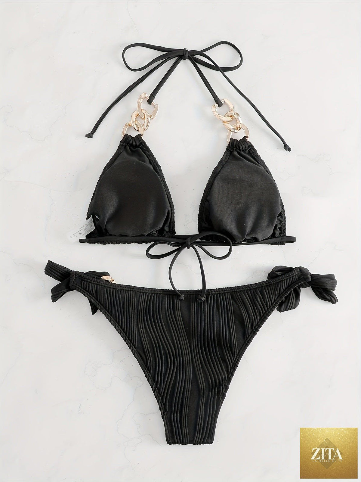 Striped gold chain bikini set with ruched texture, halter top, bow tie sides, and elegant ring link detail for summer beachwear.