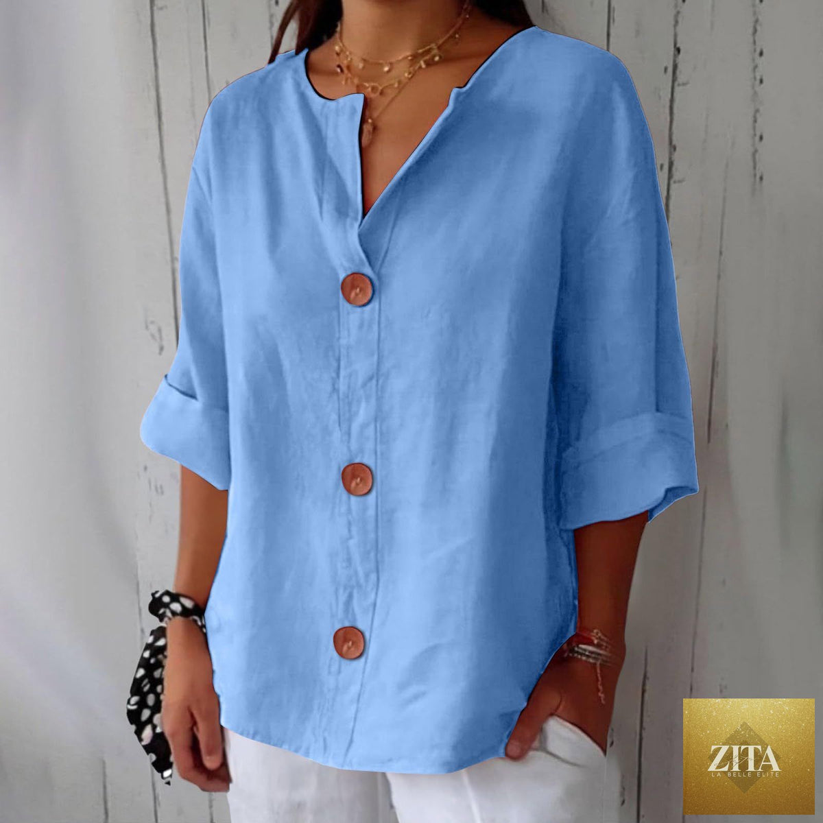 Women's FitiqueFit V-neck cotton linen blouse with button details, perfect for casualwear, shown in a relaxed fit on a model.
