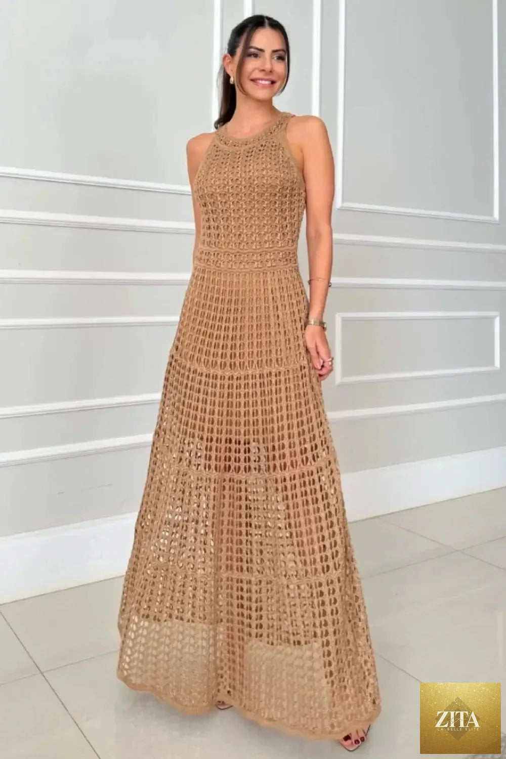 Hollowed-out sleeveless maxi dress from Shopiebay featuring a flowy silhouette and stylish cut-out details on the bodice.