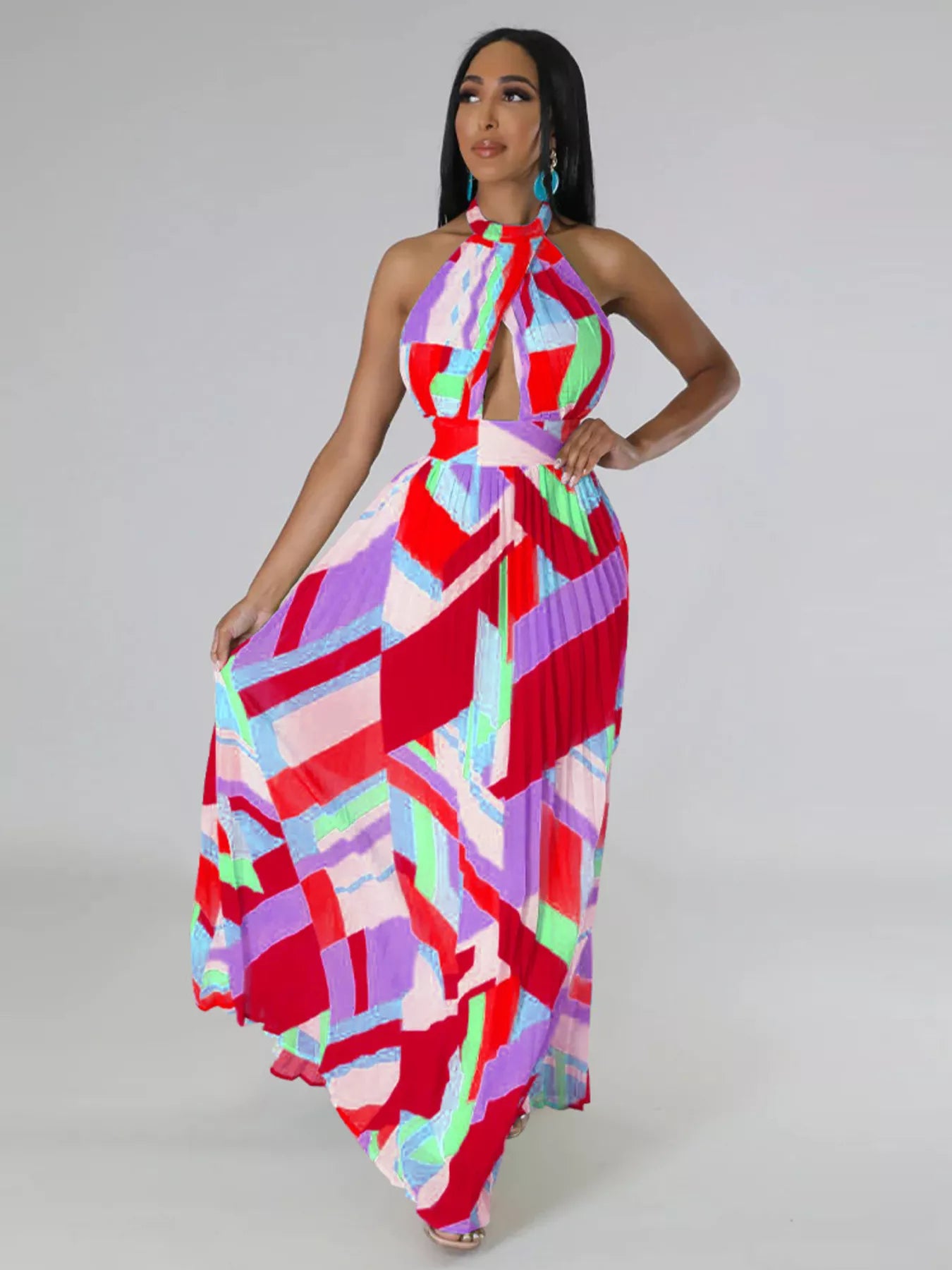 Halter neck geometric print pleated maxi dress by Shopiebay featuring a flowing silhouette and bold pattern.