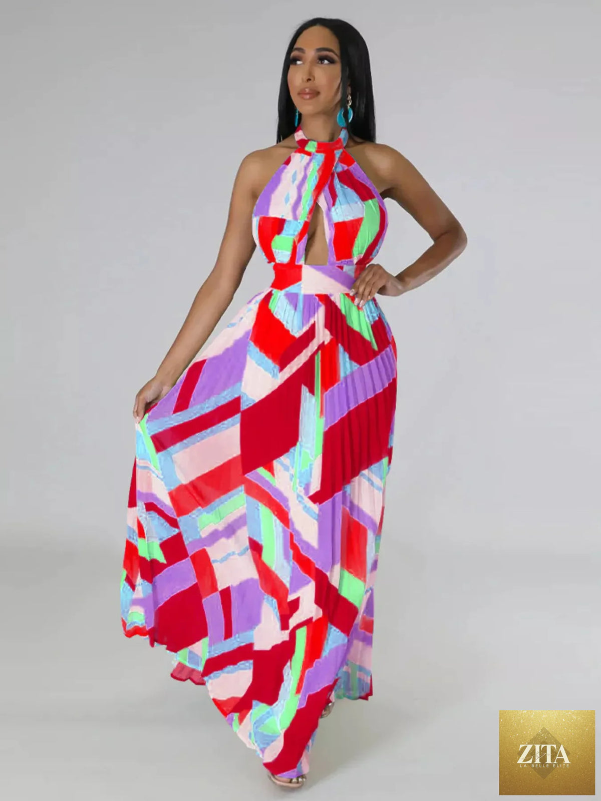 Halter neck geometric print pleated maxi dress by Shopiebay featuring a flowing silhouette and bold pattern.