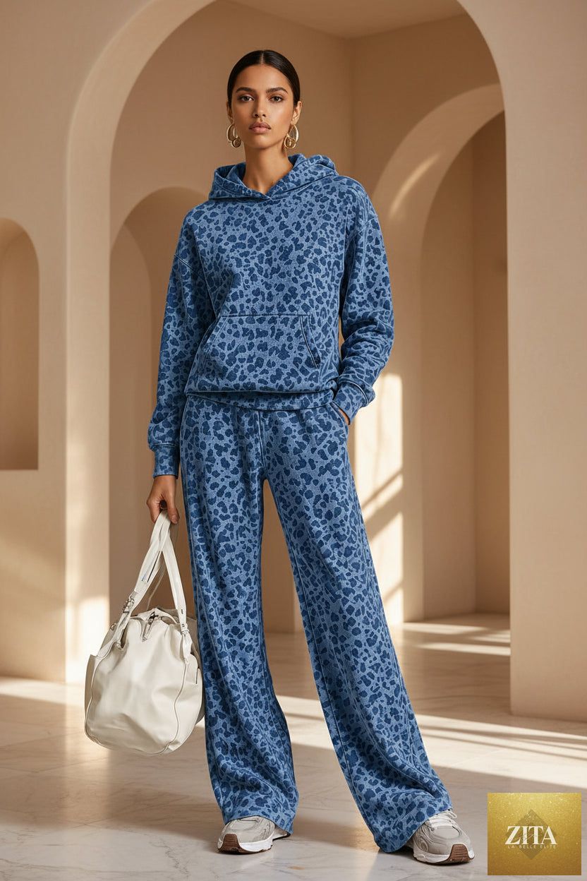 Women's washed leopard print oversized hoodie and wide-leg pants set by MERIDGE, featuring bold animal print and relaxed fit.