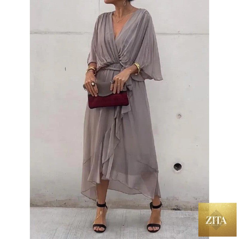 FitiqueFit Batwing Sleeve V-Neck Midi Dress with tied irregular hem, flowing fairy dress style in a lightweight fabric.