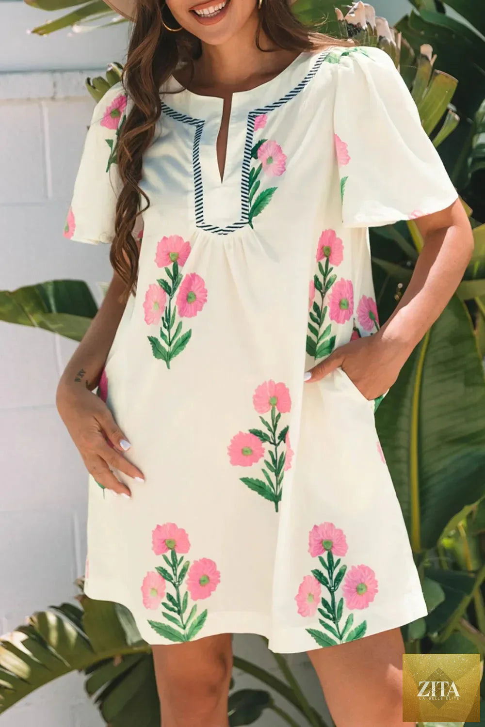 Floral print flutter sleeve summer mini dress by Shopiebay with a vibrant pattern and lightweight fabric, perfect for warm weather.
