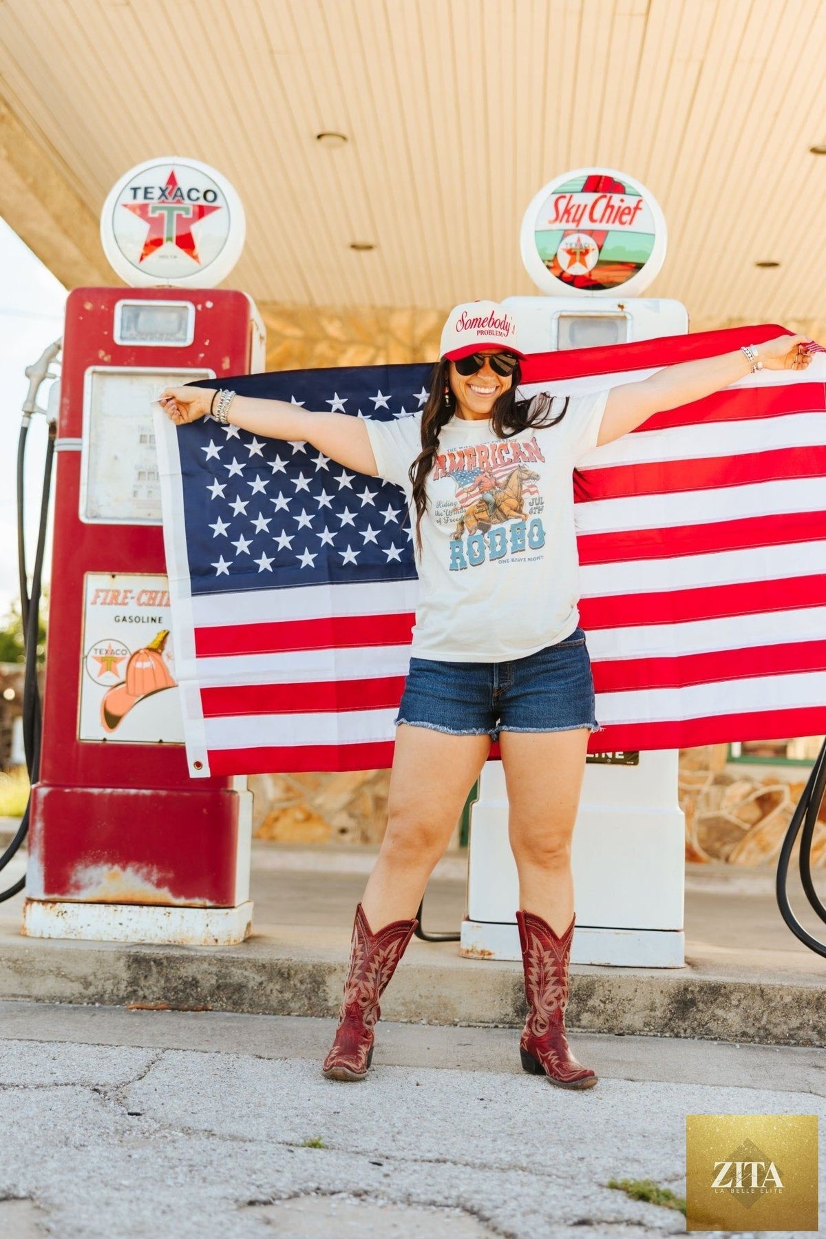 Zita La Belle Elite American Rodeo 4th July graphic tee featuring patriotic rodeo design and bold red, white, and blue colors.