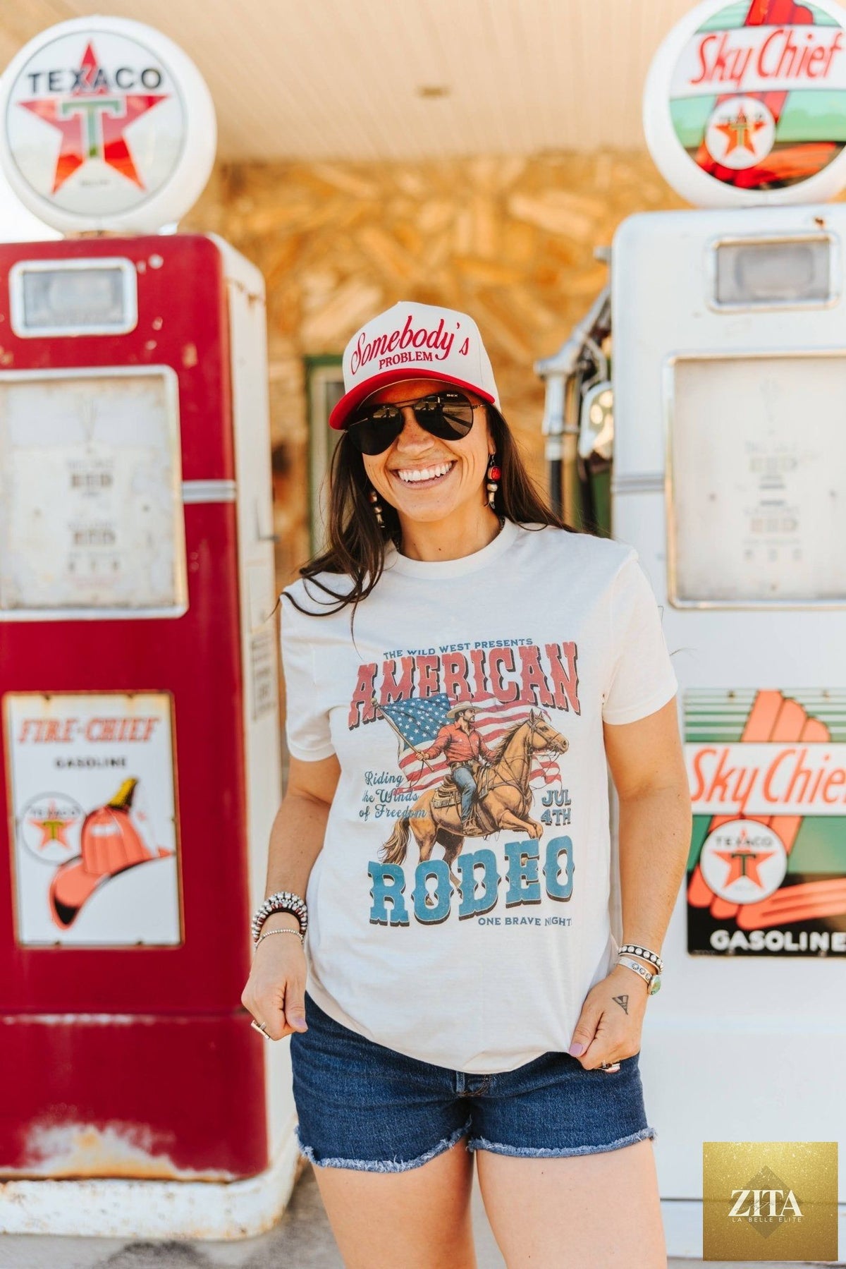 Zita La Belle Elite American Rodeo 4th July graphic tee featuring patriotic designs and bold red, white, and blue colors.