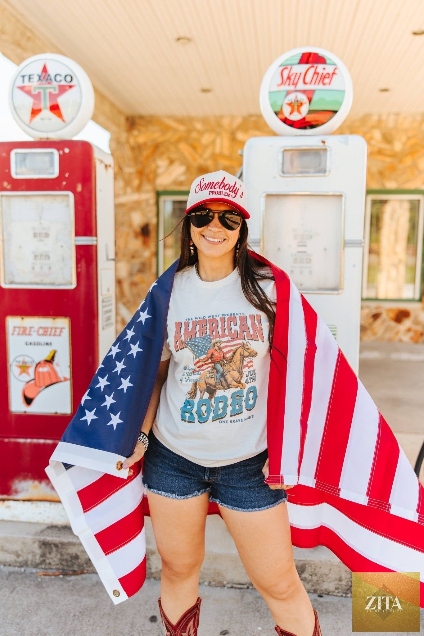 Wild Junkie American Rodeo 4th July graphic tee featuring patriotic red, white, and blue cowboy-themed design on a casual T-shirt.