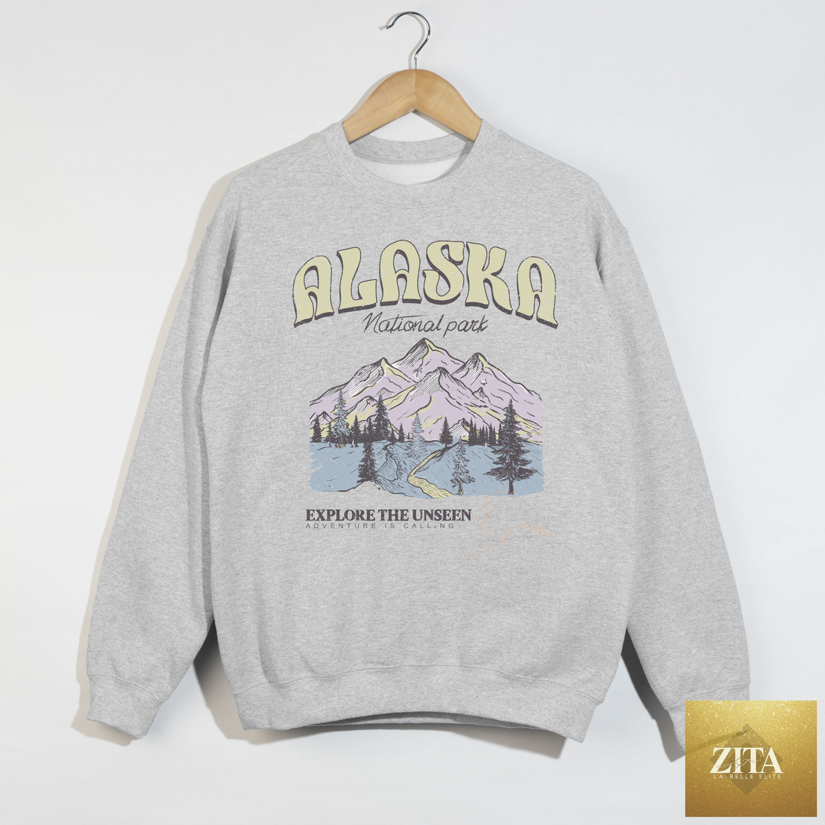 Ash grey Alaska National Park crewneck sweatshirt with vintage mountain graphic by Hey Jude Graphic Tees, showcasing mountain and park design.