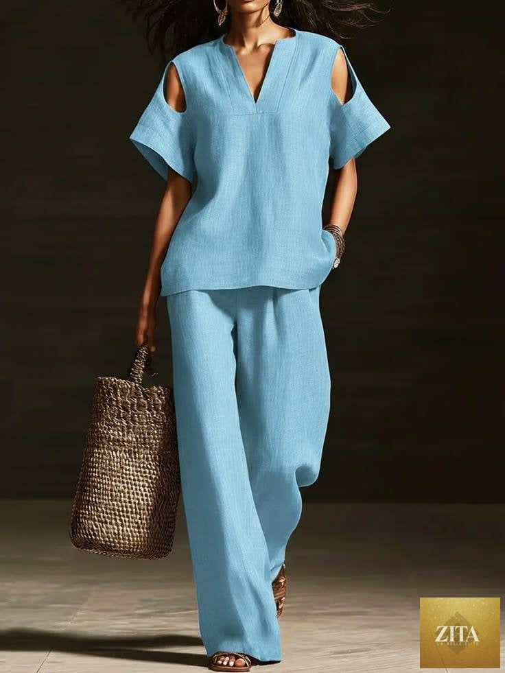 Zita La Belle Elite two-piece set with V-neck short sleeve top and straight-leg pants, ripped detail, pockets, solid color.