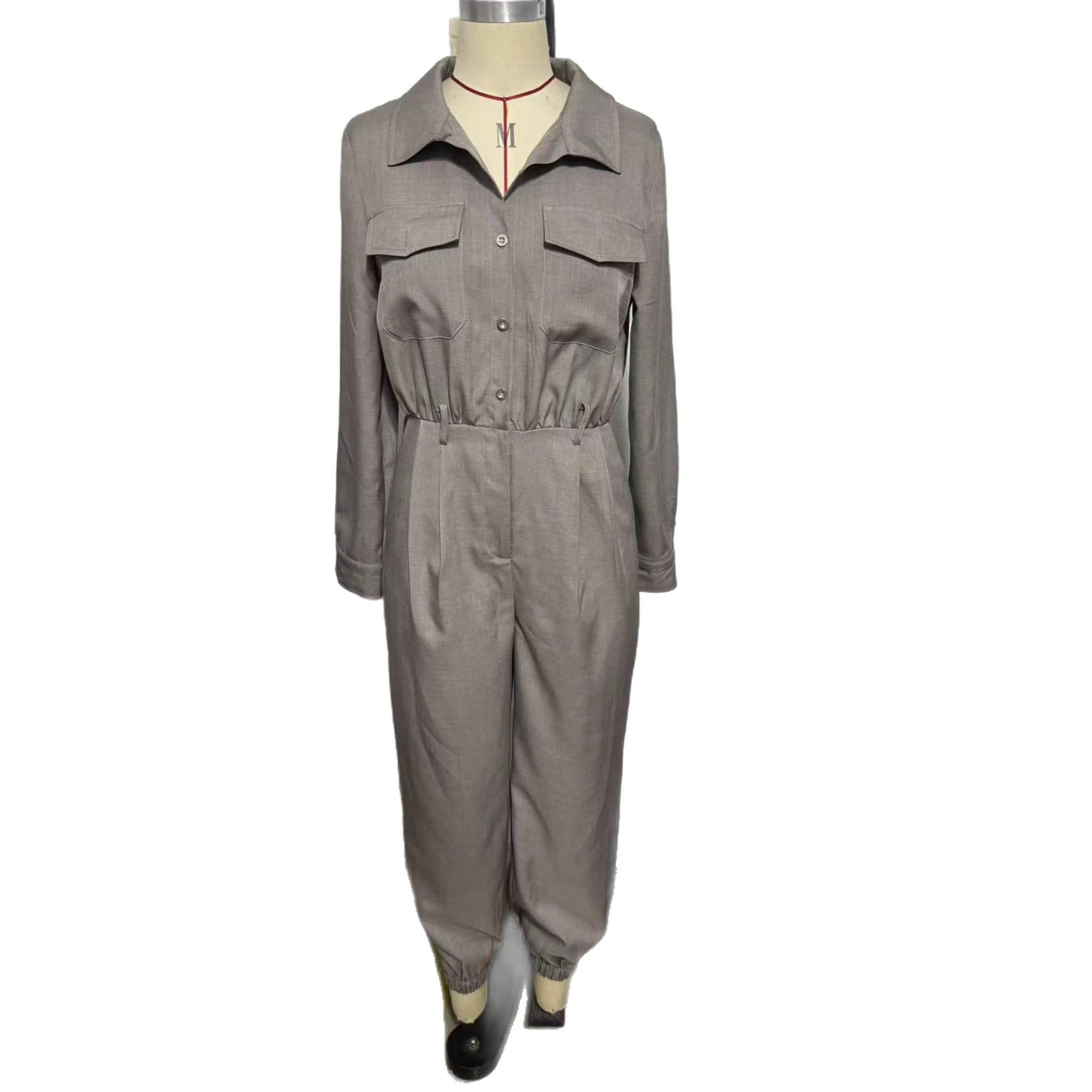 Women's long-sleeved lapel jumpsuit in stylish fabric, featuring a tailored fit and classic collar, perfect for modern fashion.