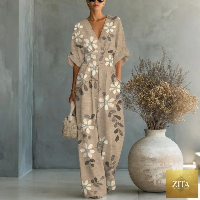 Women's waist-cinched V-neck printed wide-leg jumpsuit by Zita La Belle Elite, featuring a casual style and flowing wide-leg design.