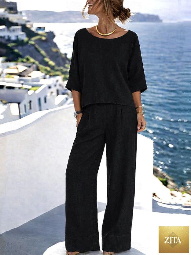 Women’s cotton linen resort set with short sleeve top and wide-leg pants by Zita La Belle Elite, displayed on a hanger.