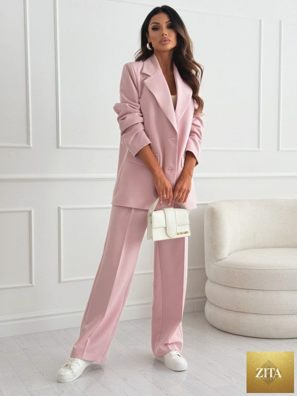 Women's professional blazer and trousers suit set by FitiqueFit, featuring a long-sleeve blazer and full-length matching trousers.