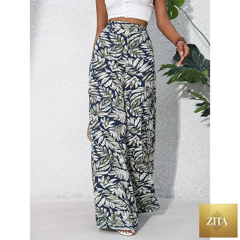 Women’s printed high-waist wide-leg Palazzo pants by FitiqueFit, casualwear with colorful floral pattern and flowing silhouette.