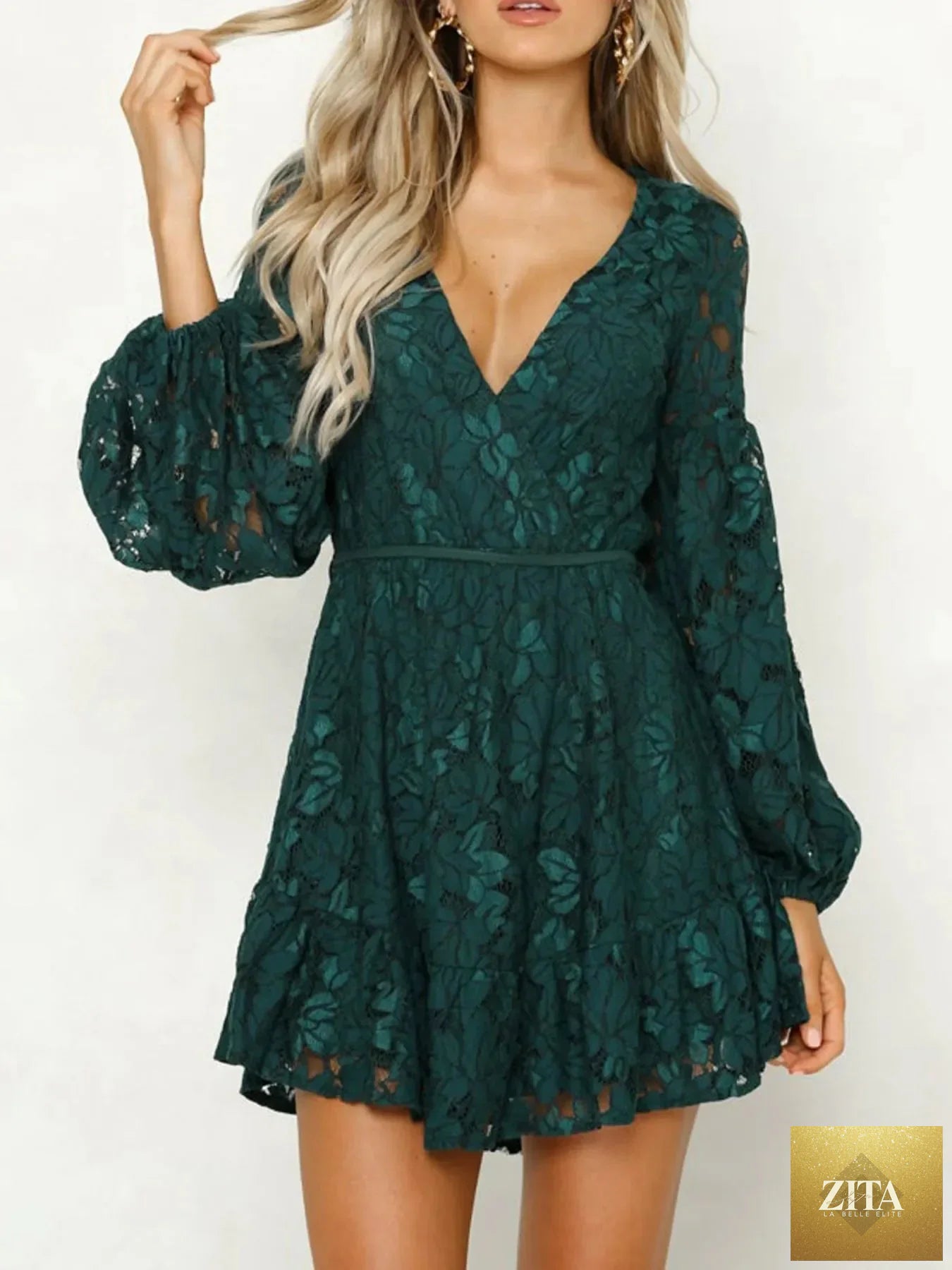 Lace V-neck long sleeve mini dress from Shopiebay featuring intricate lace details and a fitted silhouette.