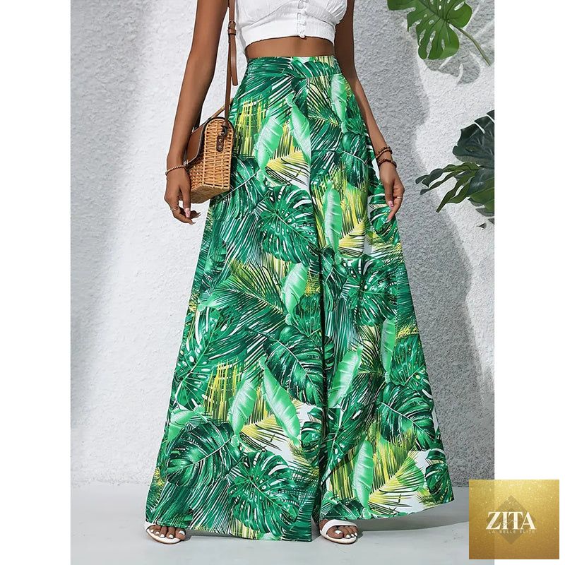 Women’s printed high-waist wide-leg palazzo pants by FitiqueFit, casualwear with colorful floral pattern and flowy silhouette.