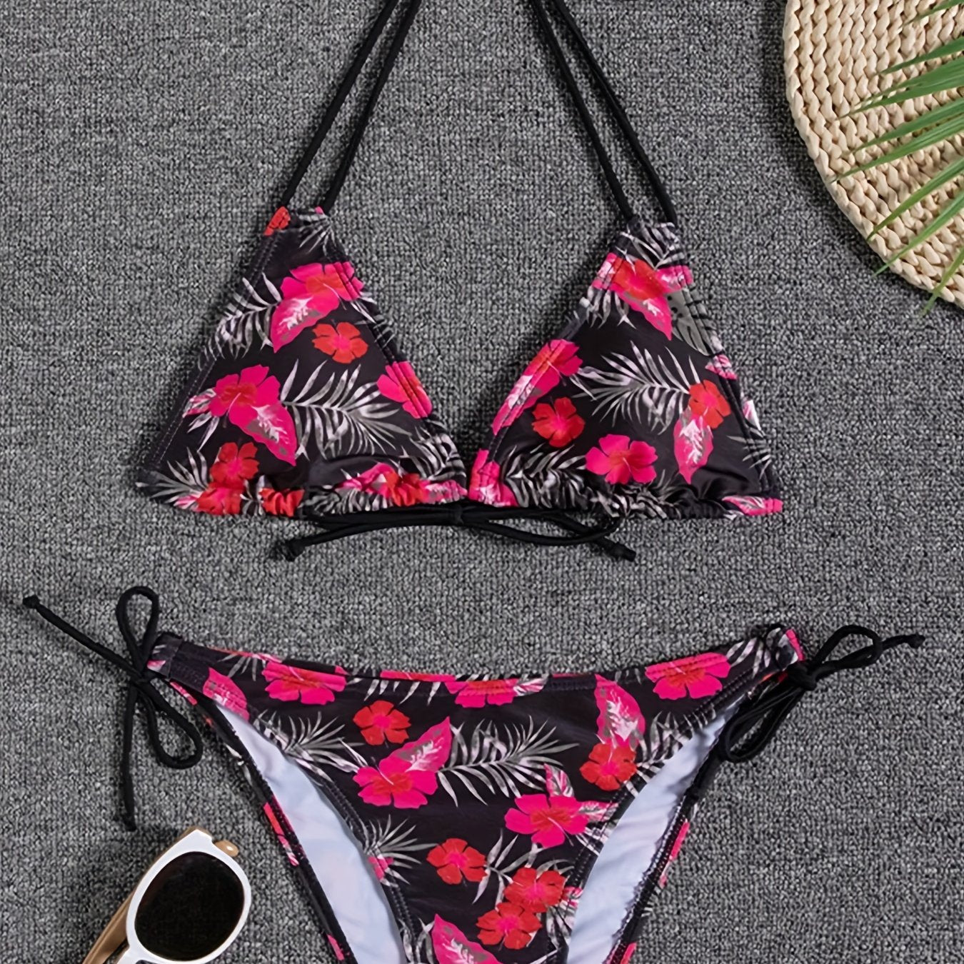 Stevvex Sunset Bloom 2-piece bikini set for women with vibrant floral print, halter neck, tie-back, and high-cut swim bottoms.