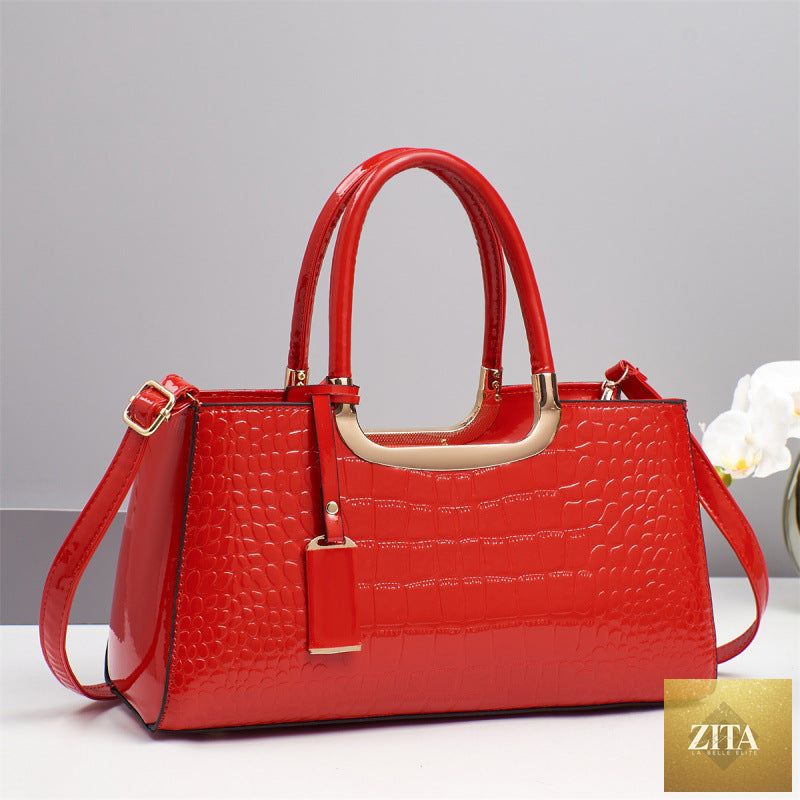Elegant genuine leather women's wedding bag with shoulder crossbody style, featuring a sophisticated design and sleek finish.