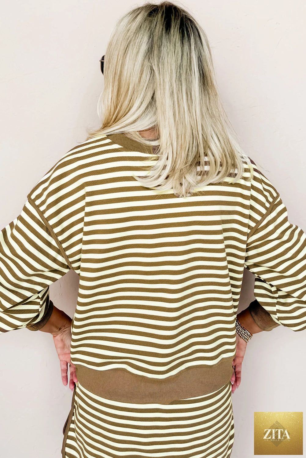 Black stripe textured drop shoulder pullover top with drawstring mini skirt two-piece dress set by Wild and Free Boutique.