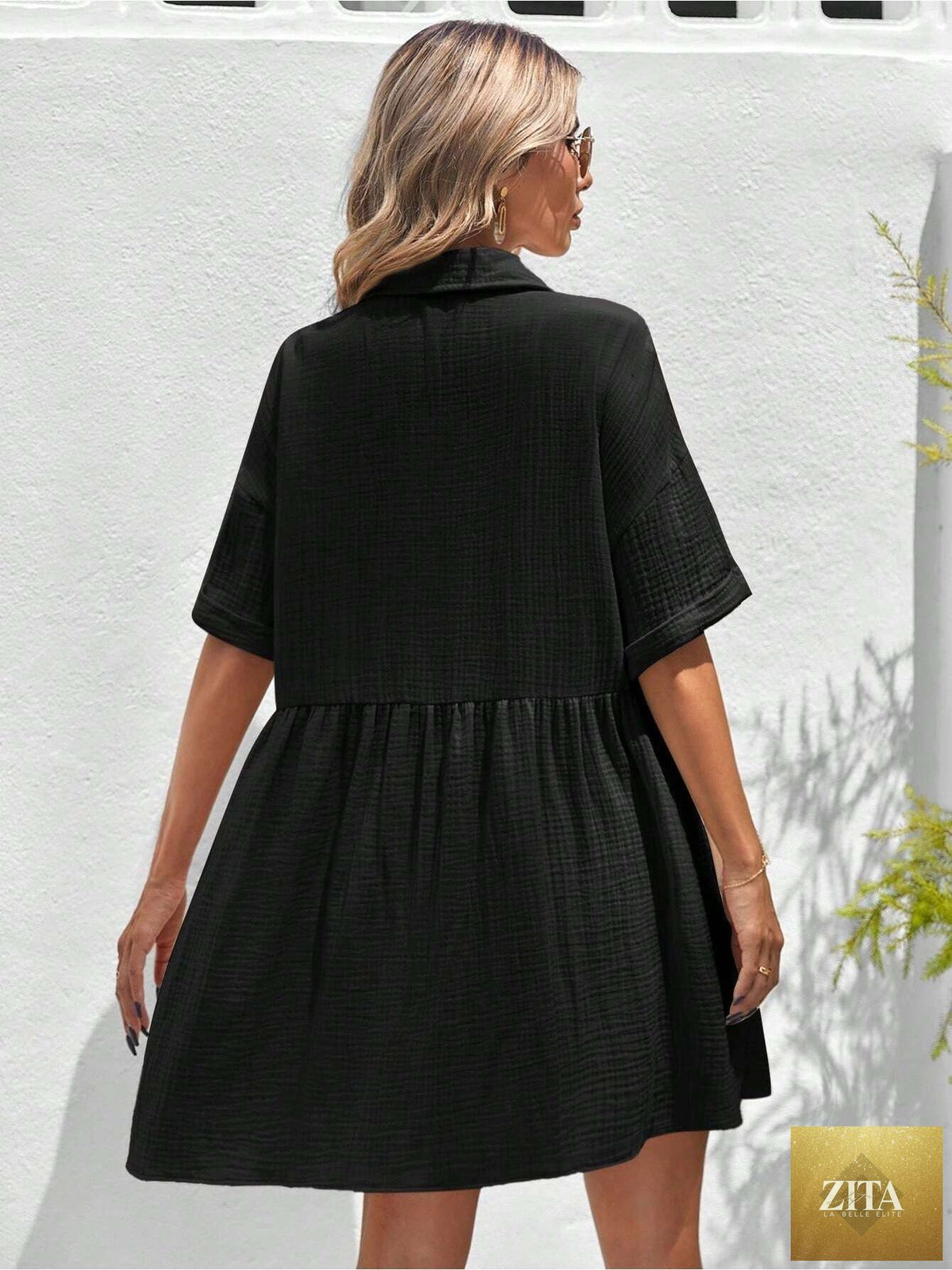 Women’s loose fit ruffle hem shirt dress by Zita La Belle Elite, perfect for casual summer holiday style, shown on a model.