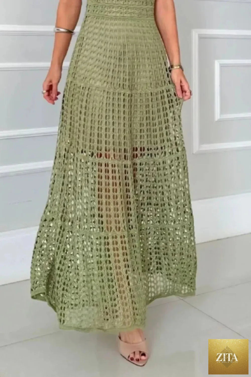 Hollowed-out sleeveless maxi dress from Shopiebay, flowing design with open back and lightweight fabric, perfect for summer wear.