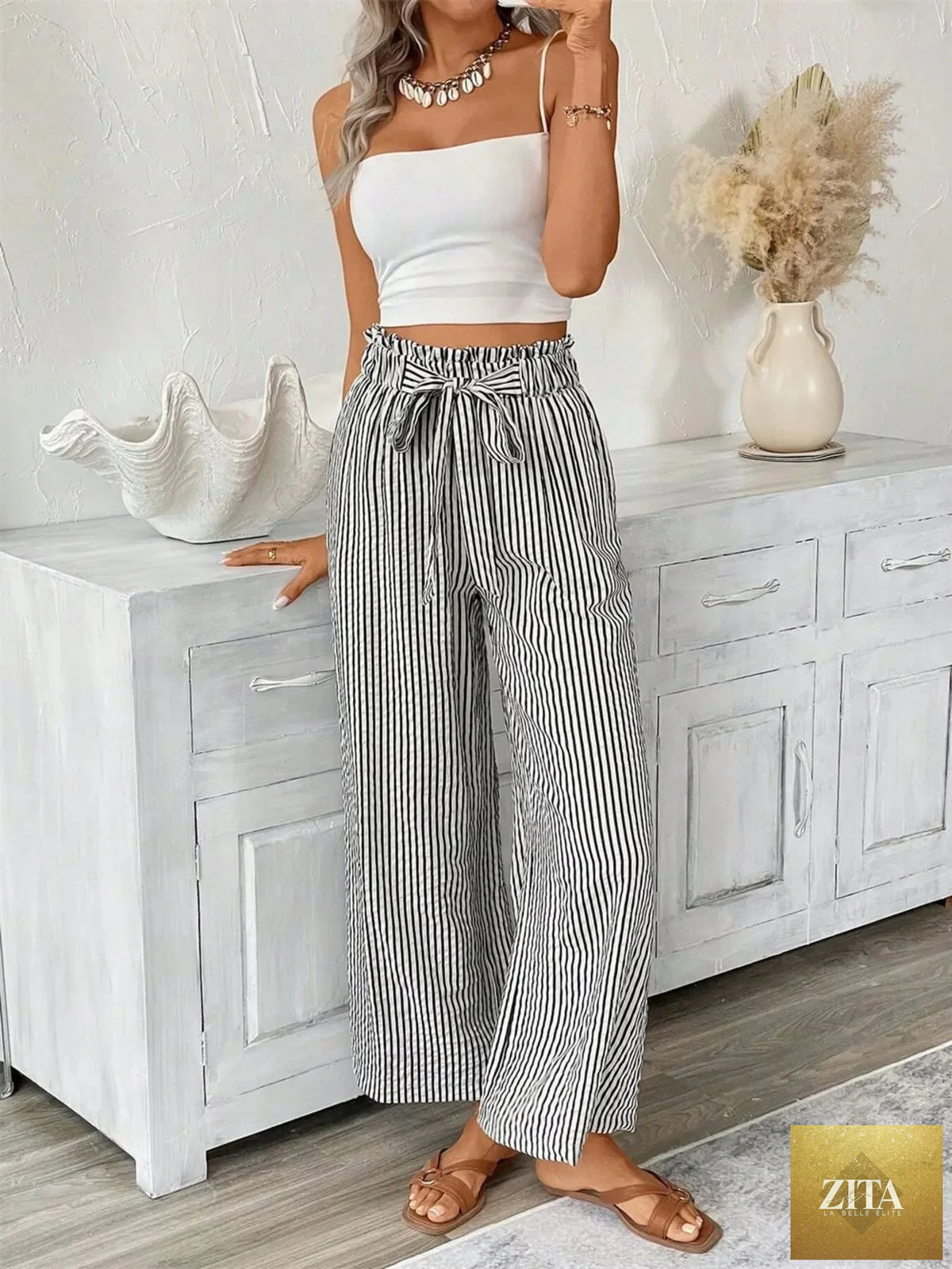 Plus size striped wide leg paper bag pants by SITRA, featuring a relaxed fit and stylish high-waist design.