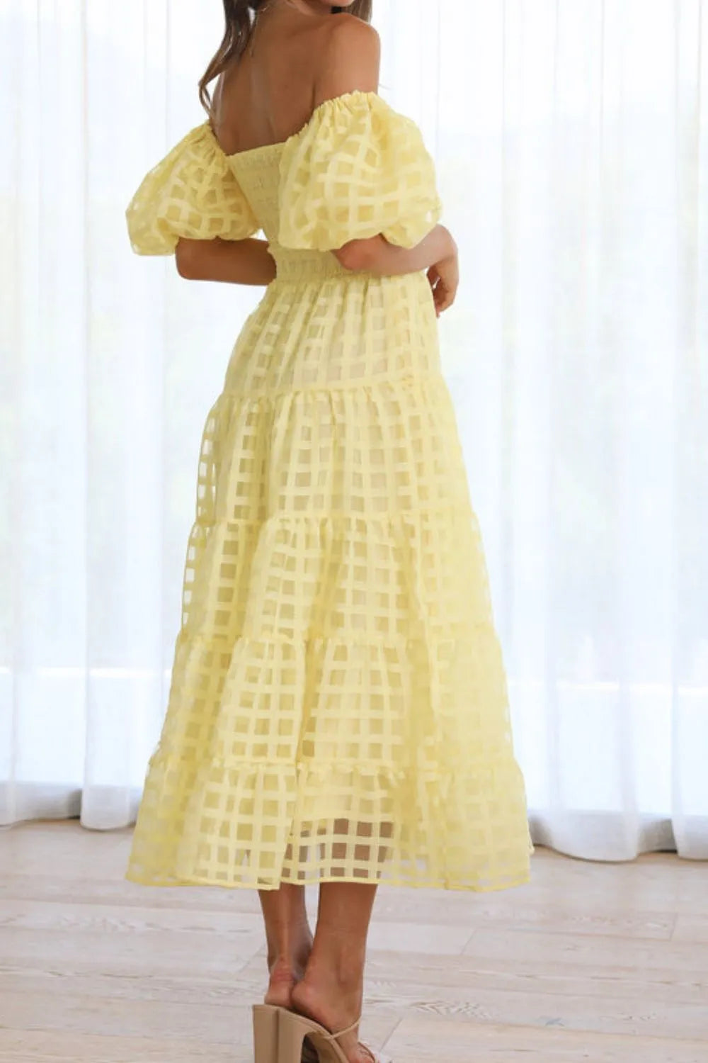 Off shoulder short puff sleeve midi dress by Shopiebay, featuring a stylish neckline and flowing fabric in a flattering silhouette.