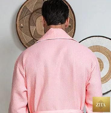 Back view of Lotus Linen men's premium waffle piping robe in small blush color, showing piping details and cozy textured fabric.