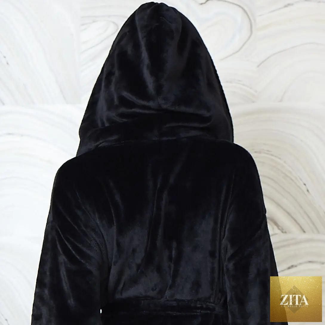 Black women's plush hooded robe by Lotus Linen, shown from the back with small hood, highlighting soft fabric and cozy design.