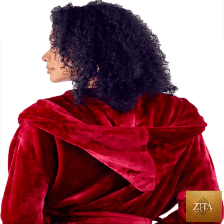 Women's plush hooded robe by Lotus Linen featuring a cozy wine-red fabric and a comfortable fit, shown from the back.