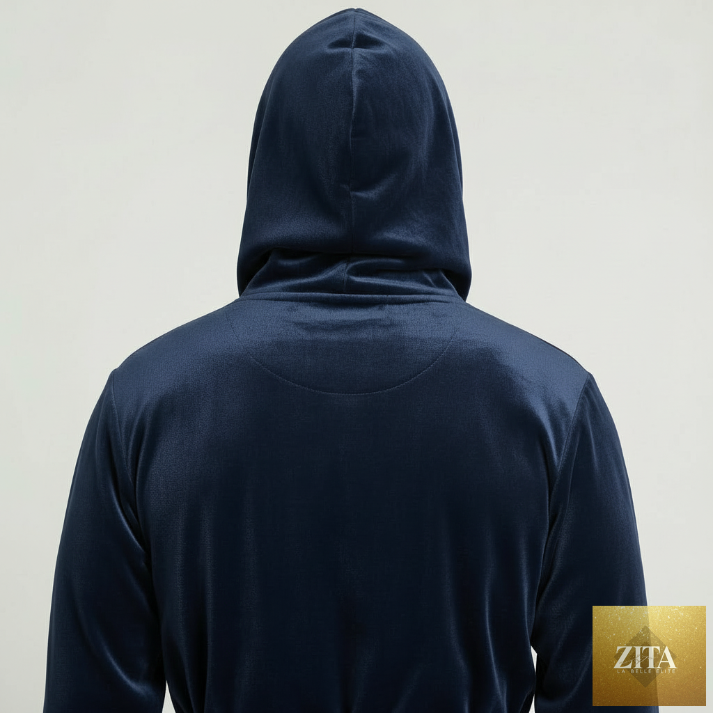 Back view of a small man wearing a navy dark grey Lotus Linen hooded plush men's robe, showcasing its soft, cozy fabric.