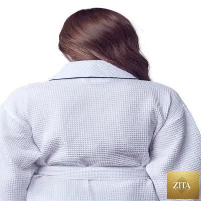 Back view of women’s lightweight white waffle piping bathrobe by Lotus Linen, spa-style comfort with small piping details.