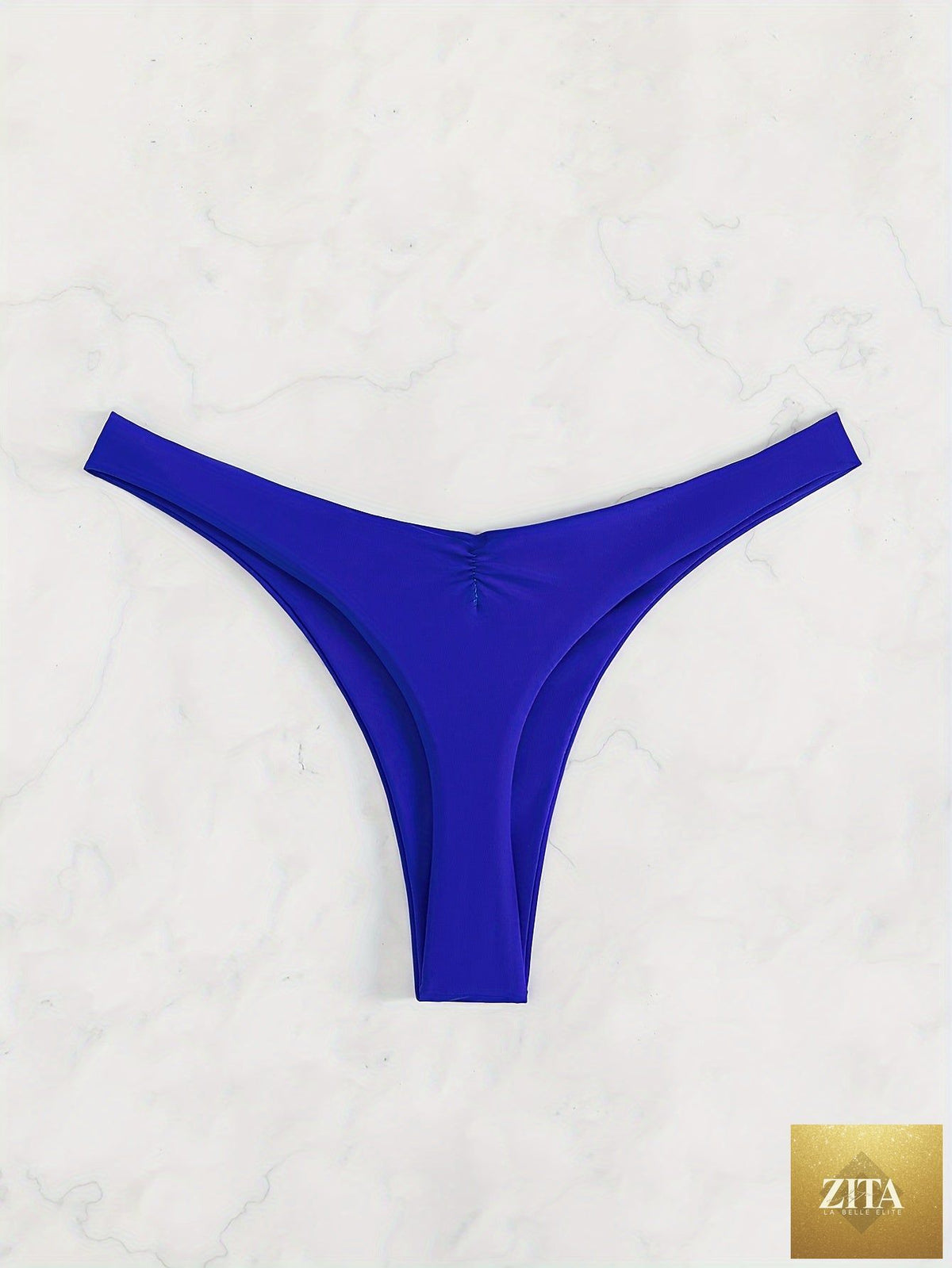Stevvex solid color cheeky ruched thong bikini bottoms for women, high stretch polyamide swimwear for beach and summer vacations.