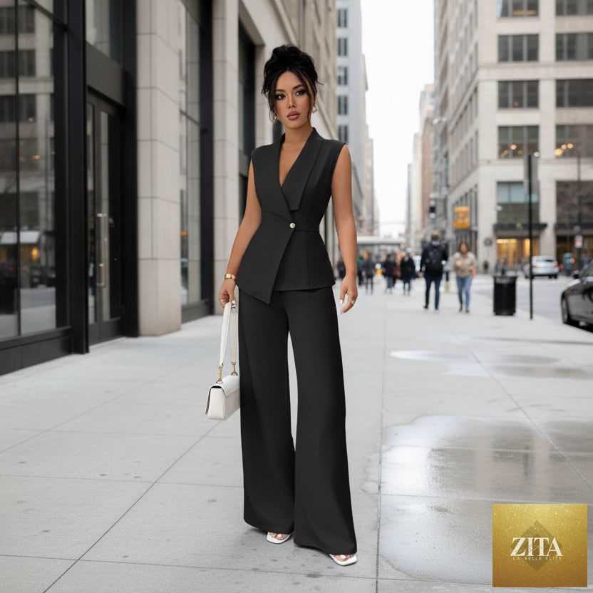 Women's sleeveless blazer and straight-leg pants two-piece casualwear set by Zita La Belle Elite, styled together in neutral fabric.