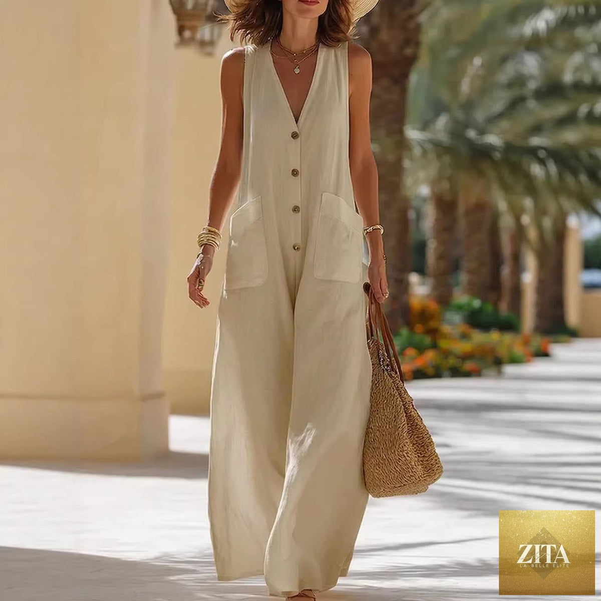 Women's sleeveless cotton-linen wide-leg jumpsuit by FitiqueFit with button pockets, styled casually, showcasing the relaxed fit and fabric details.