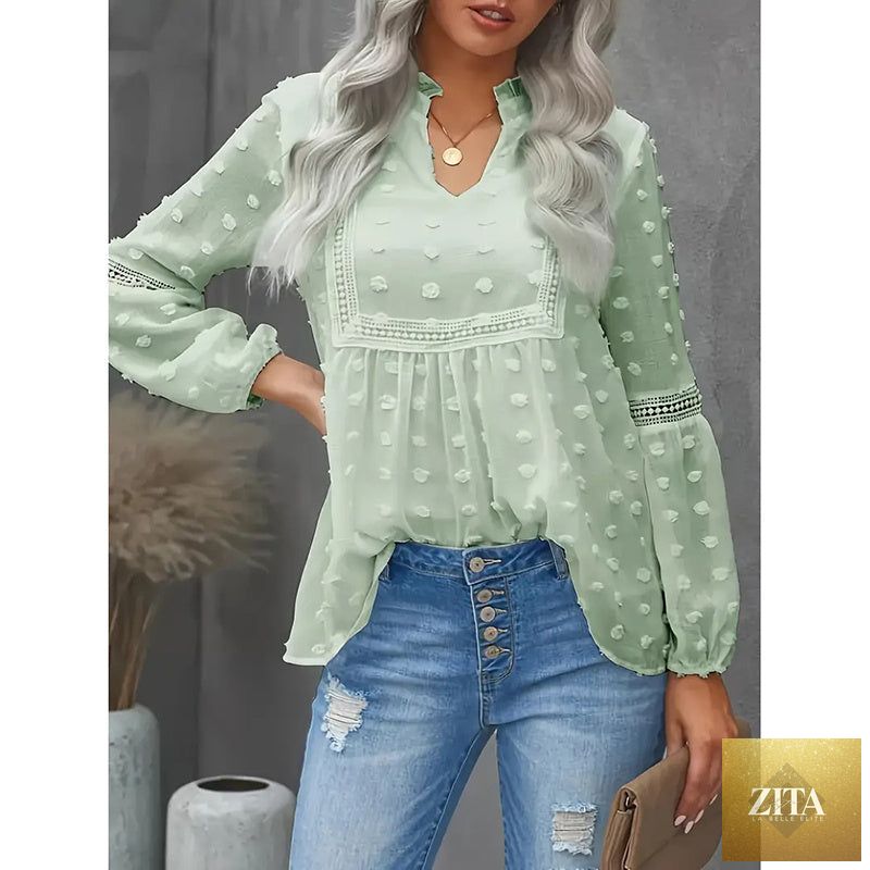 Women's long-sleeve V-neck business casual blouse by FitiqueFit, shown in a neutral color on a hanger.