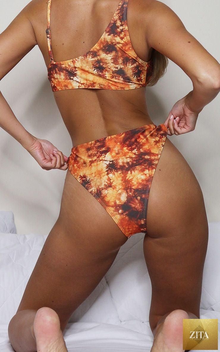 Stevvex two-piece women's bikini with cut-out design, chain ring accents, string top, and matching bottom for summer beachwear.