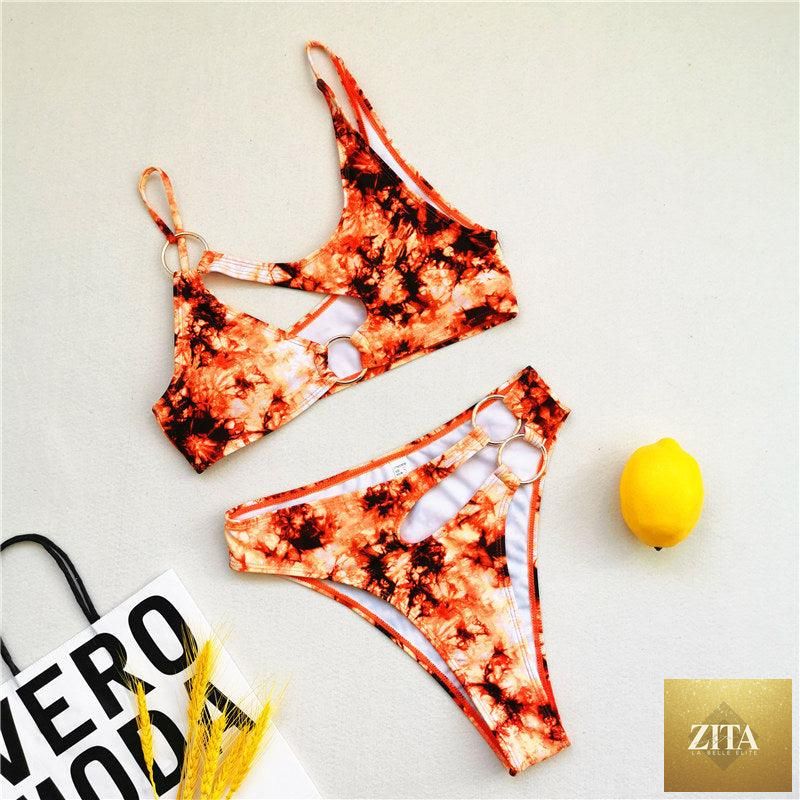 Stevvex two-piece women's bikini with cut-out design, chain ring accents, string top, and matching bottom, ideal for summer beach wear.
