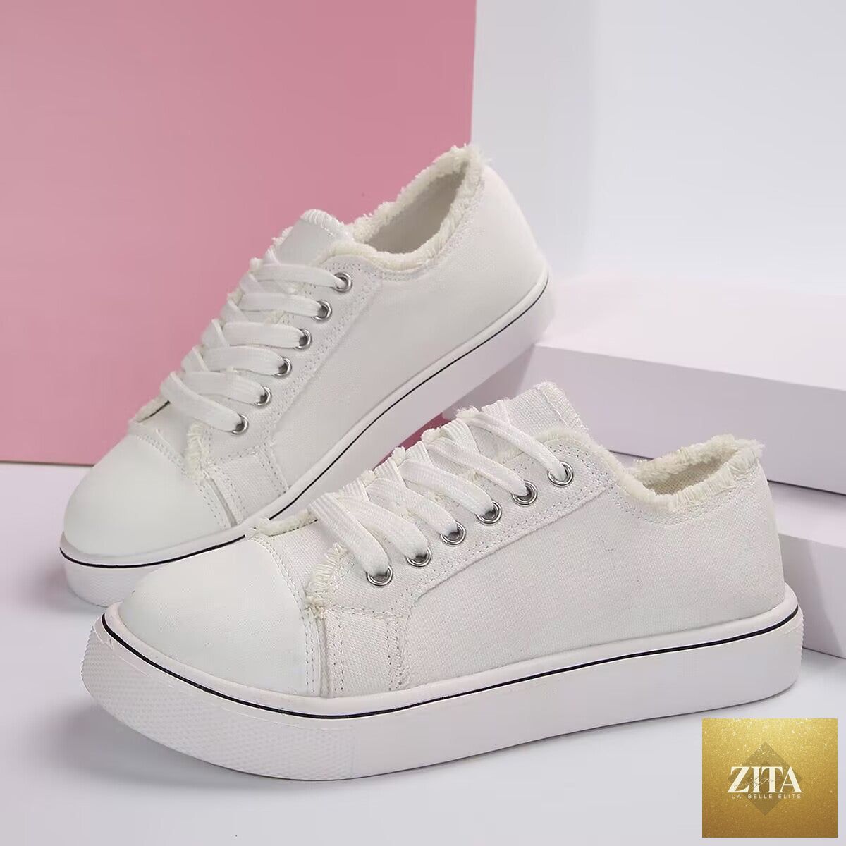 Women's lightweight lace-up canvas sneakers by FitiqueFit featuring low-top design and flat soles, perfect for casual wear.