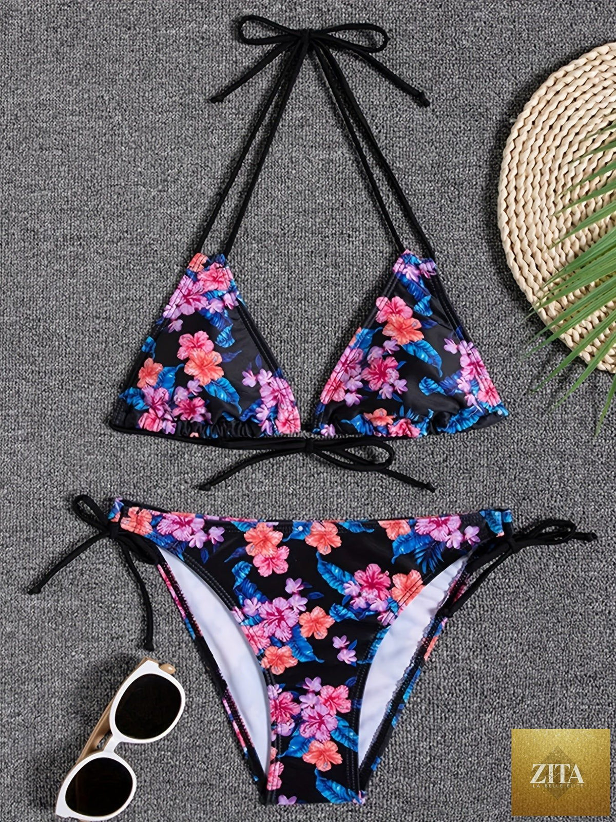 Stevvex Sunset Bloom 2-piece bikini set for women with vibrant floral print, halter neck, tie-back, and high-cut bottoms.