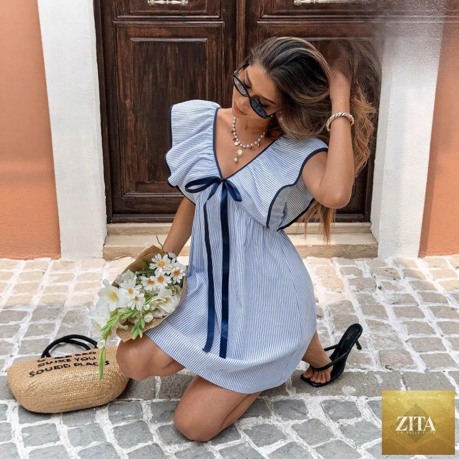 Women's FitiqueFit V-neck ruffle puff sleeve mini dress, flirty summer dress with feminine details and a stylish silhouette.