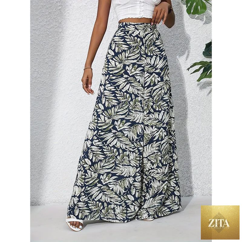Women’s printed high-waist wide-leg palazzo pants by FitiqueFit, showcasing colorful floral pattern and flowing casualwear style.