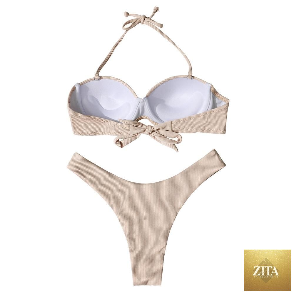 Stevvex leopard bikini set for women, halter triangle top and cheeky bottoms, perfect for summer beachwear and swimming.