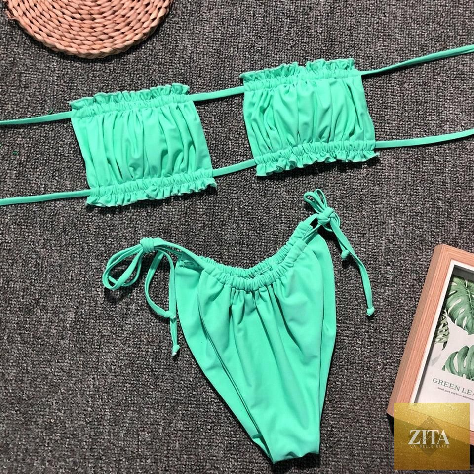 Stevvex women's bikini set with ruffle tie sides, high cut strapless design, padded solid swimsuit for summer beach wear.