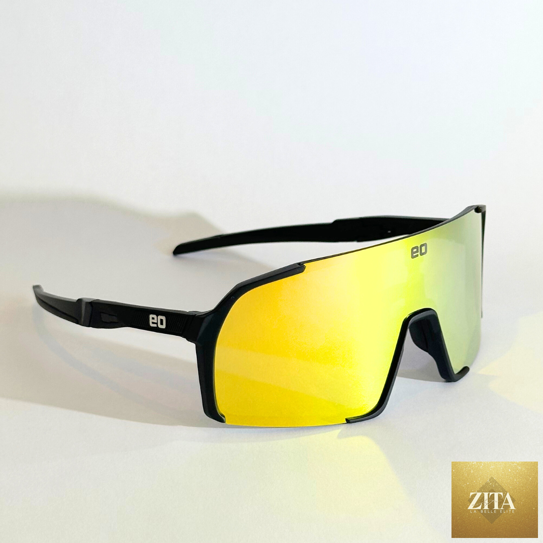 Black and gold Uno Mas Photochromic+ sunglasses by Eastern Outer with tinted lenses and sleek frame design.