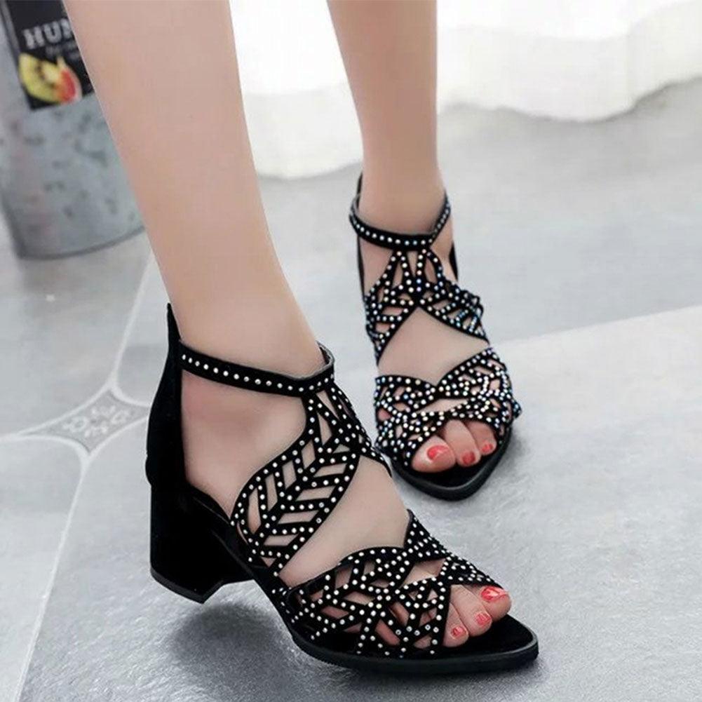 Black Stevvex women's summer sandals with hollow-out leather design, rhinestones, thick heel, zipper, and non-slip breathable soles.